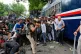 Police hit supporters of the Cockroach Janta Party as they attempt to march toward India's Parliament, demanding the resignation of the education minister, in New Delhi, India, July 20, 2026