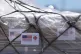 People load pallets containing food and hygiene kits for a humanitarian assistance flight to Cuba organised by the Trump administration as the US continues to put strangle the island, July 21, 2026, in Miami