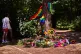 Flowers and rainbow flags placed at a tree in the Tiergarten Park near the scene where a car rammed into people after Saturday's Pride March in Berlin, Germany, July 27, 2026