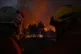 Firefighters battle a blaze outside Lanton, during wildfires in southwestern France, July 28, 2026