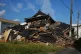    A collapsed building is seen in Yatsushiro, southwestern Japan, Wednesday, July 29, 2026, the day after an earthquake hit the area