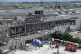 In this aerial image taken with a drone, responders work outside a mall after an explosion occurred following an earthquake, in Kashima, Kumamoto Prefecture, southern Japan, July 30, 2026