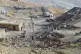 People wait as rescue workers prepare to start a search operation after an explosion inside a coal mine on the outskirts of Quetta