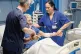 VITAL TO THE COMMUNITY: Cuban doctor Daysi Luperon Loforte (right) help lift up patient Francesco Ascone at the Santa Maria degli Ungheresi Hospital of Polistena on June 16, 2026