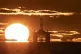 The sun rising behind a redundant oil platform moored in the Firth of Forth near Kirkcaldy, Fife