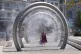 A lady walks through a water feature spraying a fine mist to cool off in Dover, Kent, July 8, 2026