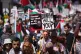 People take part in a National March for Palestine organised by Palestine Coalition, in central London
