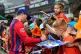 Jos Buttler of Manchester Super Giants signs autographs for young fans after The Hundred men's match at Headingley, Leeds, July 28, 2026