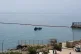 Civil Guard boats patrol alongside floating barriers off the coast of the Spanish enclave of Ceuta