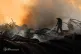 A Ukrainian firefighter puts out a fire following a Russian missile attack in Dnipropetrovsk region, Ukraine,