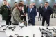 Russian President Vladimir Putin, center, speaks with Vladimir Tkachuk, front, the head of the Uraldronzavod, during his visit to the Special Technology Centre in St. Petersburg, Russia, Thursday, Sept. 19, 2024