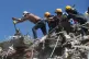 Residents and rescue workers search through the rubble after an earthquake struck Cali, Colombia, August 10, 2026
