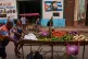 Street vendors push their cart of vegetables past a mural of Fidel Castro in Havana, Cuba, August 12, 2026