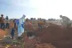 A health worker sprays disinfectant in a freshly dug grave for the body of Jacques Lobo Dhena, who died of Ebola, in Bunia, Ituri province, eastern Congo, August 12, 2026
