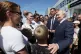 Russian President Vladimir Putin, right, interacts with local residents in Kurilsk on the Iturup Island, the largest of the Kuril Islands of Russia's far-east, August 13, 2026