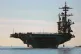 Sailors and Marines line the deck of aircraft carrier USS Abraham Lincoln (CVN-72) as it deploys from San Diego, January 3, 2021
