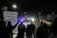 Federal immigration officers confront protesters outside Bishop Henry Whipple Federal Building in Minneapolis, January 15, 2026