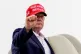 President Donald Trump gestures while boarding Air Force One at Morristown Airport, Sunday, Aug. 16, 2026, in Morristown, N.J