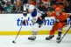 Edmonton Oilers centre Leon Draisaitl (left) controls the puck as Anaheim Ducks right wing Beckett Sennecke defends, April 26, 2026