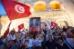 People take part in a protest against rising prices, declining purchasing power and shortages of basic goods in Tunis, Tunisia, August 20, 2026. Banner in French showing Preident Kais Saied reads ‘Leave’