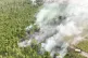 n this aerial photo relased by Indonesia's National Disaster Mitigation Agency (BNPB) on Friday, Aug. 21, 2026, smoke billows as a wildfire razes through a peatland forest in Bulungan, North Kalimantan, Indonesia
