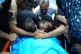 Relatives of Palestinian Karim Shalaldeh, 17, cry over his body at a hospital in the West Bank city of Hebron, August 21, 2026