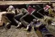 PAWNS IN A POLITICAL GAME: Migrants who crossed into Spain from Morocco sleep on a Ceuta beach, August 3 2026