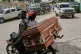 Men transport an empty coffin on a motorcycle in the Kenscoff neighbourhood of Port-au-Prince, Haiti, August 25, 2026
