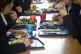 Students eat their school dinner from trays and plates during lunch in the canteen at Royal High School Bath, which is a day and boarding school for girls aged 3-18 and also part of The Girls' Day School Trust, the leading network of independent girls' schools in the UK