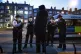 Cops talk to a person following a stop and search in Walworth, Southwark, March 6, 2021