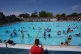 kids in a south London lido after sent home from school during the heatwave