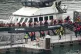 A group of people are brought in to the Border Security Command compound in Dover, Kent, from a Border Security Command vessel following a small boat incident in the Channel, August 17, 2026