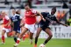 Arsenal's Lisa Baum (left) battles for the ball with Paris FC's Hillary Diaz during the pre-season friendly match at Mangata Developments Stadium Meadow Park, Borehamwood, August 23, 2026