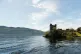 Urquhart Castle in Scotland with Loch Ness next to it
