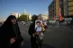A woman holds a picture of Iran's Supreme Leader Mojtaba Khamenei 
