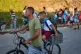 A man takes his son to school on his bicycle for the first day back to classes in Minas, Cuba's Havana province, September 1, 2026
