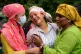 Relatives console Muna Khadka, center, who lost her son Aayush Khadka in flash floods, at a cremation ground in Chitwan, Nepal, Monday, Aug. 31, 2026