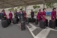 Qatar Airways flight attendants wait to be cleared during a workers strike at Jomo Kenyatta International Airport in Nairobi, Kenya, Monday, Aug. 31, 2026