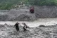 Residents pull a newly installed zipline to help people commute across the Trishuli river in the aftermath of flash floods at Bidur in Nepal's Nuwakot district, Nepal, September 2, 2026