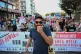 A protester shouts slogans with a megaphone during a protest rally near Thessaloniki's international trade fair, in the northern city of Thessaloniki, Greece