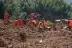 rescuers search for survivors in a mudslide-hit area of Mingkeng village in Suichuan, in China's eastern province of Jiangxi