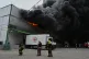 Firefighters put out a fire at warehouse stores after a Russian air attack in Odesa, Ukraine