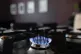 Gas hob burning on a stove in a kitchen