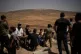 Backdropped by an Israeli settlement, mourners attend the funeral of two Palestinians who were killed by Israeli forces, September 3, 2026