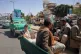 Men ride in the back of a pickup truck during a funeral procession for Houthi officers and military personnel in Sanaa, Yemen, September 16, 2026