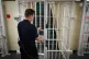  17/01/14 of a door being closed by a prison guard at a Young Offenders Institution
