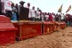 People attend a burial ceremony for school children who died in a fire that swept through two schools in the city of Bukavu, eastern Congo, September 14, 2026