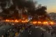 Protesters burn tires and other debris to block a highway as demonstrations over fuel price increases spread across Syria, in Maarat al-Numan, Idlib province, September 13, 2026
