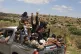 Yemeni civilians celebrate in the Bani Matar district, Yemen, September 12, 2026, as they follow a convoy carrying Houthi prisoners freed in Mokha following the Houthi takeover of the southern Red Sea port city