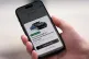 A client orders an autonomous cab on his mobile phone as Uber officially launches the first hailable robotaxis in London